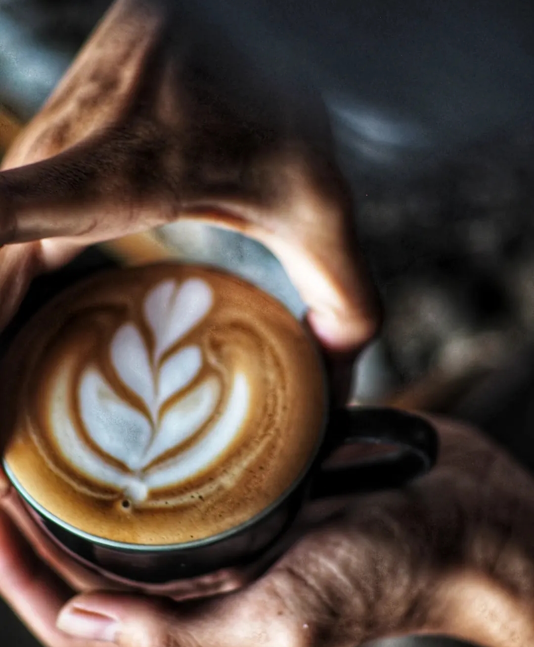 Latte art held by hand