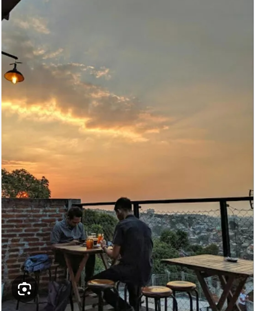 Guests enjoying sunset at encycoffeedia